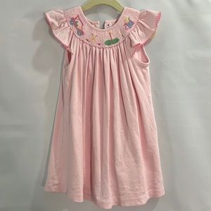Petit Bebe pink bishop dress with golf smocking.